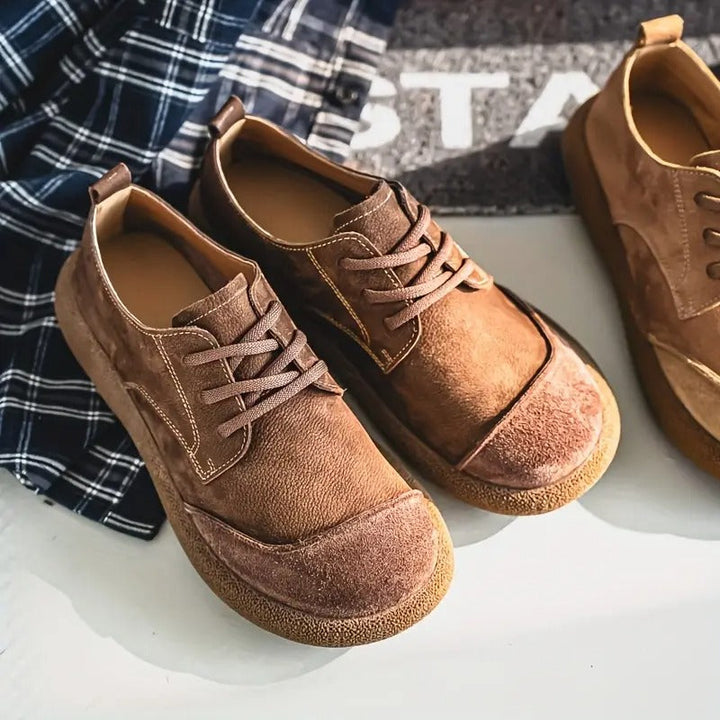 Slip-on men's brown leather orthopedic shoes, offering comfort & support for daily activities.