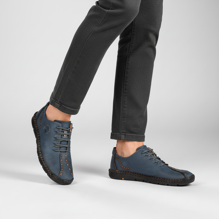 Close-up of men's orthopedic leather sneakers, highlighting durable stitching and comfort design.