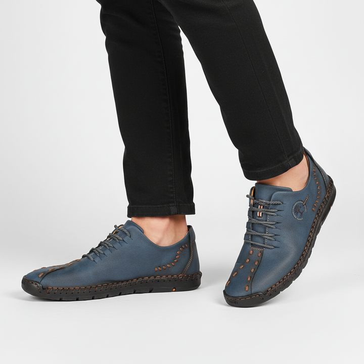 Pair of men's comfort footwear: orthopedic leather sneakers with a stylish and durable finish.