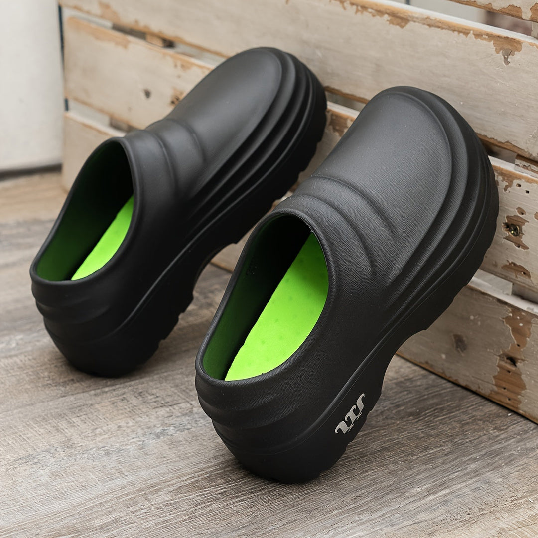 Men's orthopedic waterproof clogs in black, offering all-day comfort & foot support.