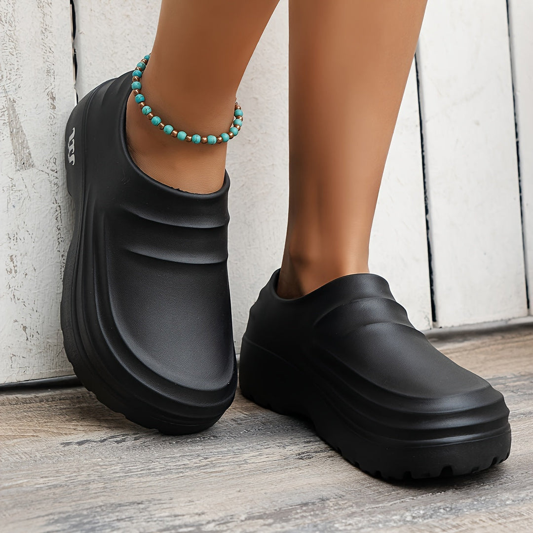 Comfortable men's waterproof work clogs with adjustable fit & superior foot support.