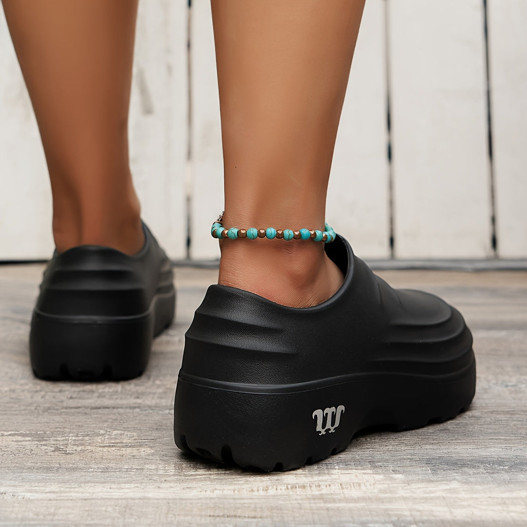 Slip-on waterproof clogs for men, providing orthopedic comfort & protection for various tasks.