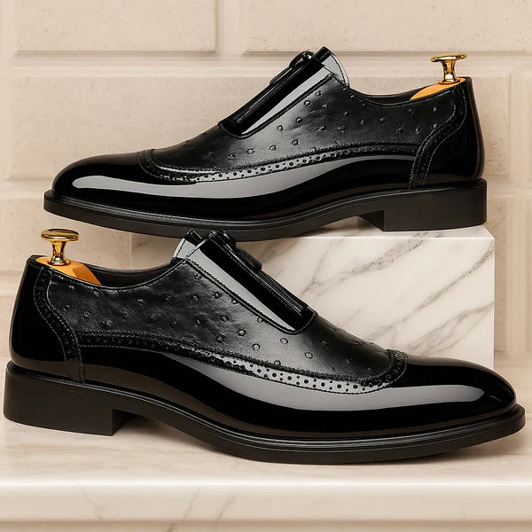 Detailed view of ostrich texture on men's oxford dress shoes. Sophisticated design with a functional side zip.