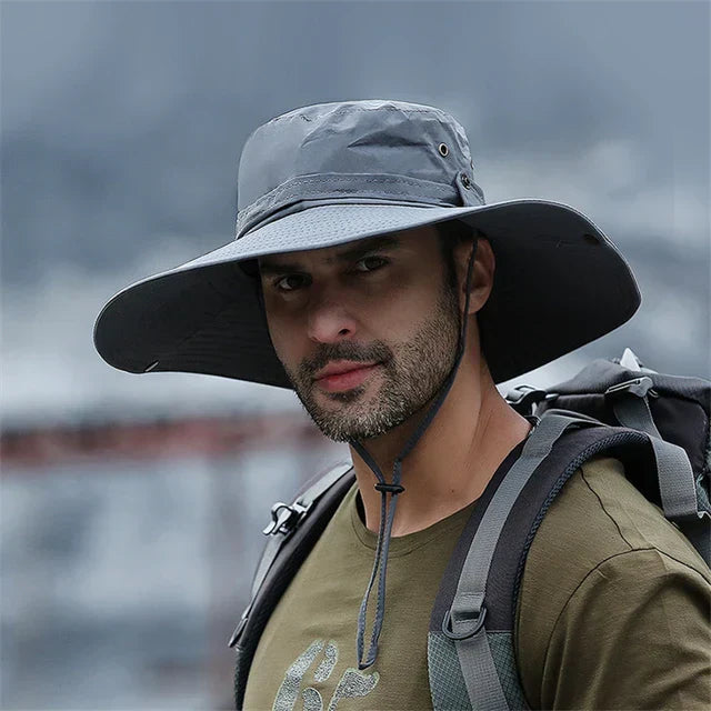 Men's breathable outdoor bucket hat for hiking, fishing, beach, and travel. Chin strap & sun protection.