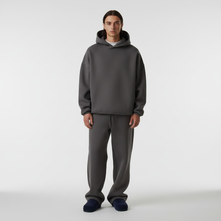 Relaxed fit men's oversized tracksuit, featuring a hoodie and joggers in a dark color