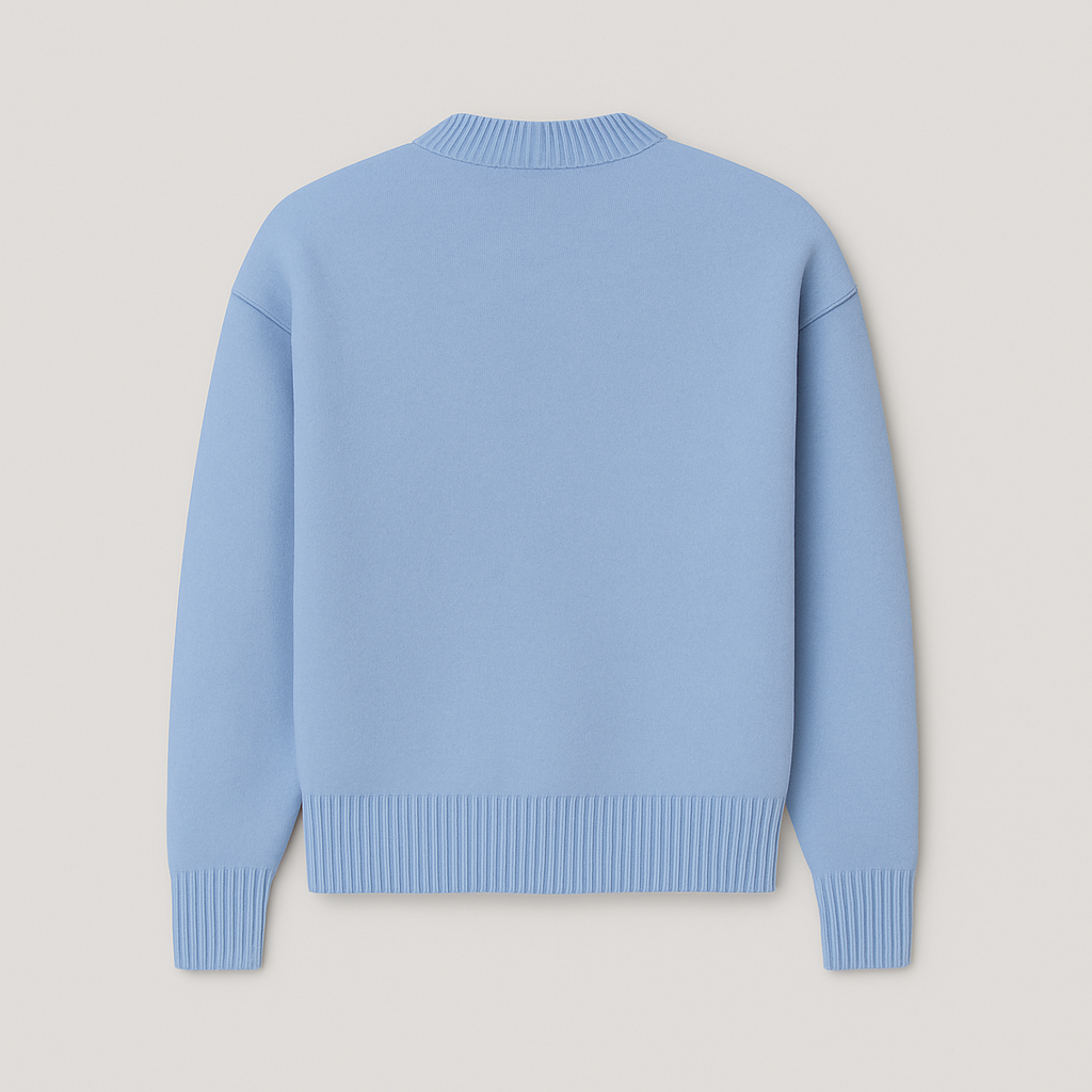 Close-up of men's oversized crew neck sweater, highlighting the unique heart motif and comfortable fabric texture.