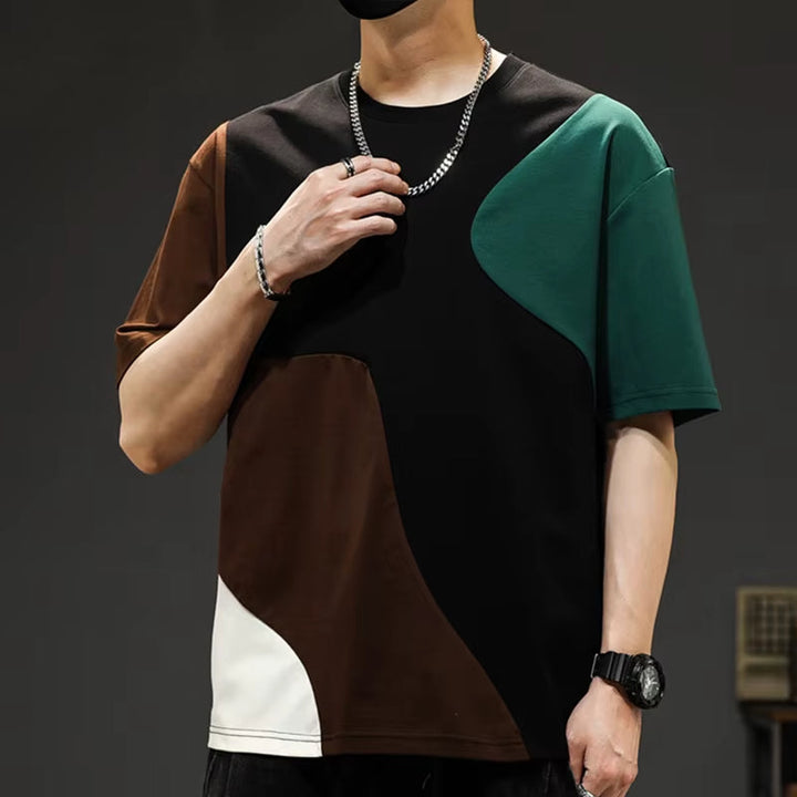 Men's statement top: urban style crossover panel tee with a relaxed, oversized fit and comfortable drop shoulders.
