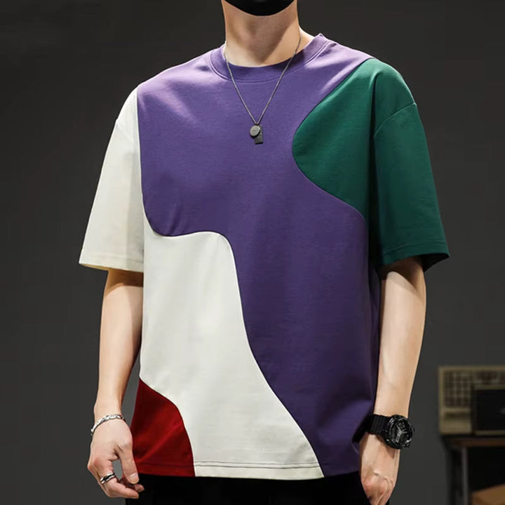Modern men's apparel: oversized crossover panel t-shirt with a relaxed fit, offering both style and comfort.
