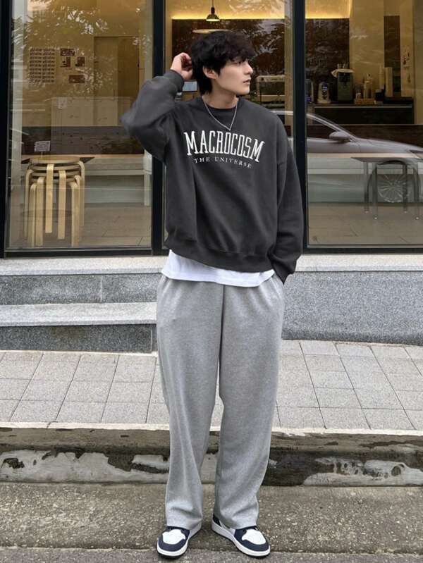 Stylish men's oversized graphic crewneck sweatshirt, offering a comfy relaxed fit for modern casual fashion.