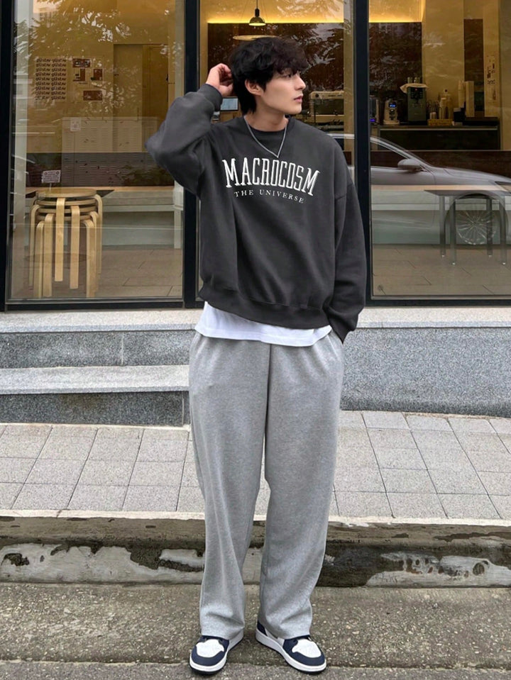 Front view of a men's oversized graphic sweatshirt, showcasing the unique print and relaxed fit for casual style.