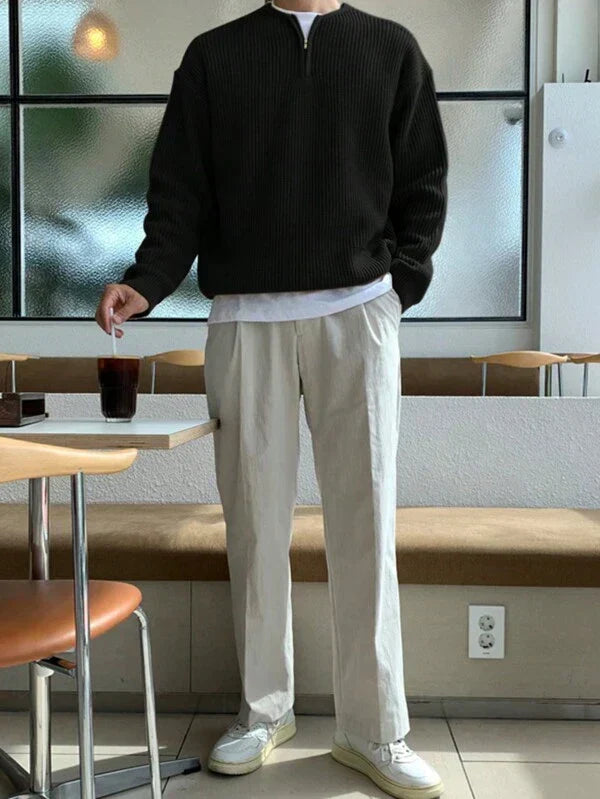 Model wearing a comfortable men's oversized zip-up jumper, showcasing its relaxed fit and modern style.