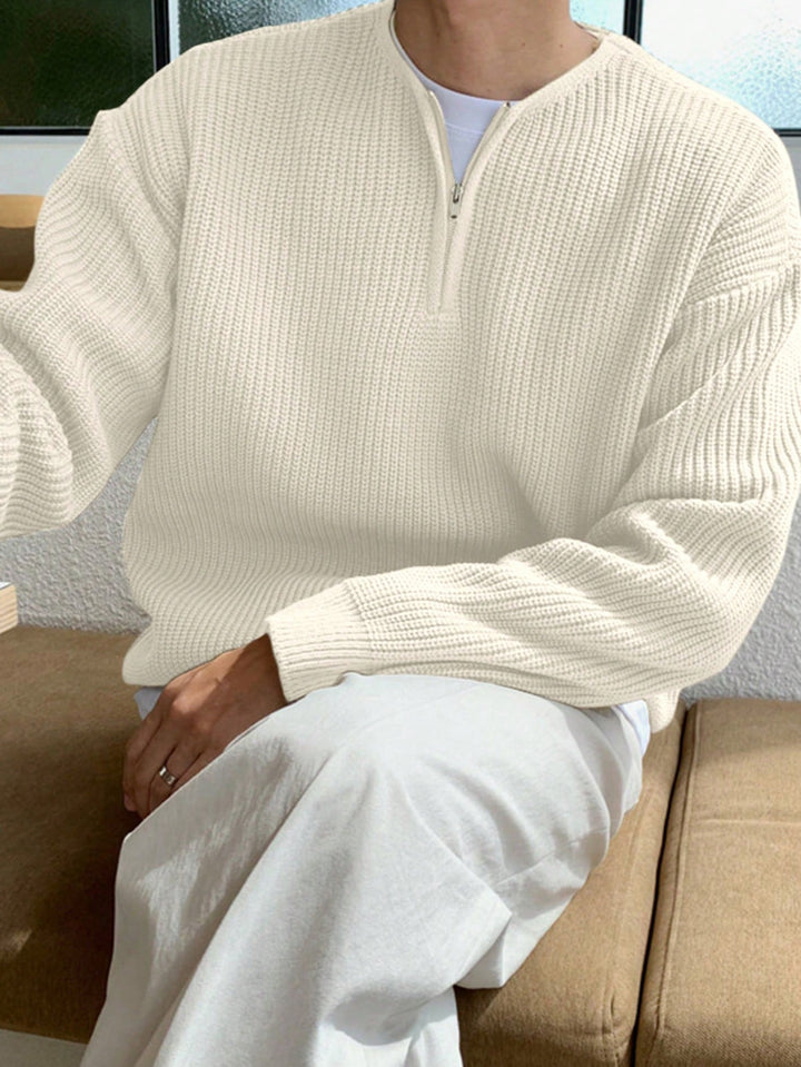 Side view of men's oversized zip-up jumper, emphasizing its relaxed silhouette and comfortable wear.