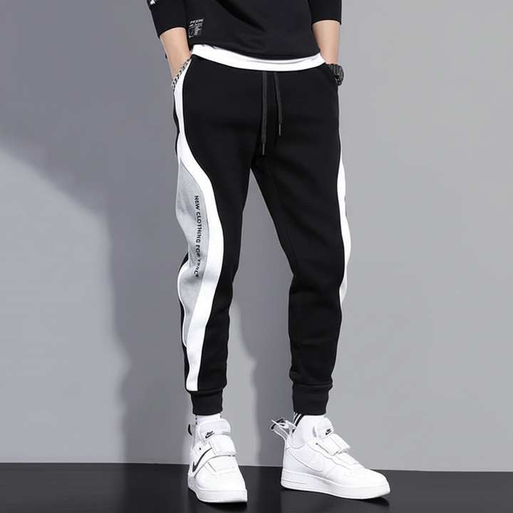 Stylish men's jogging pants with unique patchwork design, perfect for athletic activities and casual outfits