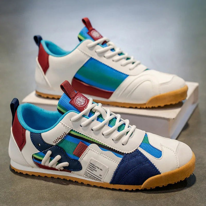 Versatile men's trail & street sneakers in a modern patchwork design, blending style & function.