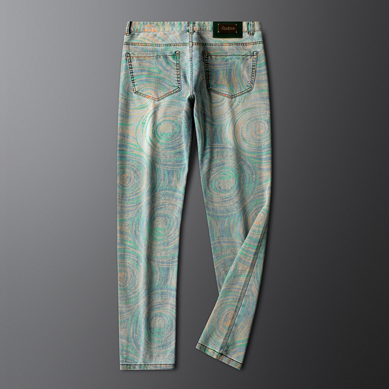Designer men's patterned denim jeans with a unique prism tribal print, offering comfortable and stylish retro fashion.