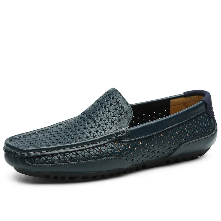 Black men's perforated slip-on loafers, ideal for everyday comfort and a sleek casual style.