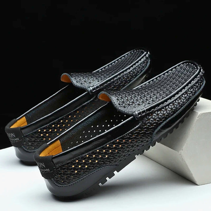 Stylish men's perforated slip-on loafers in a smart casual design for comfort.
