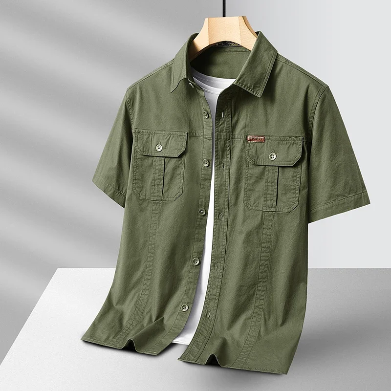 Men's performance button-up shirt in blue, quick-dry & moisture-wicking for all-day comfort & travel.