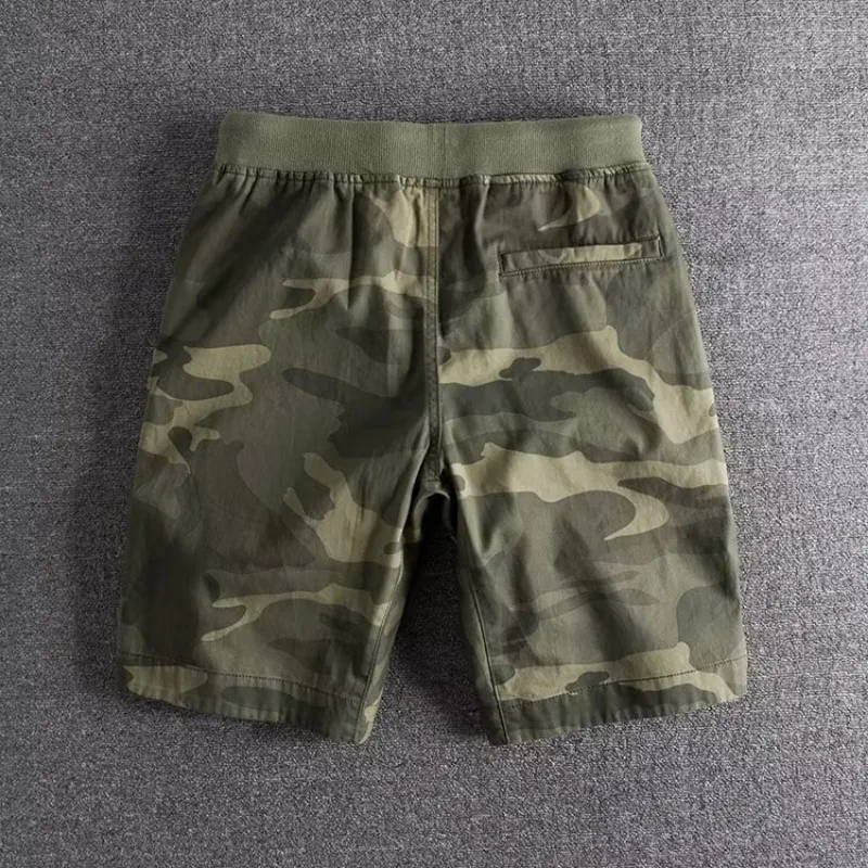 High-performance men's camouflage workout shorts, ideal for gym, running, and active sports.
