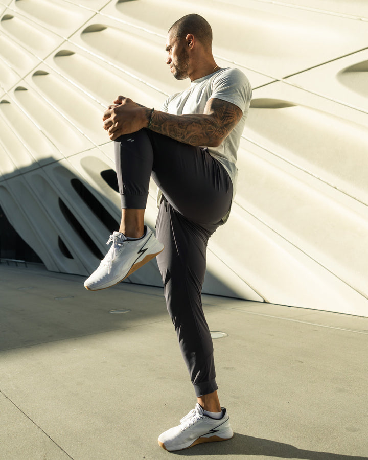 Minimalist view of men's performance joggers, highlighting clean modern fit & casual comfort.
