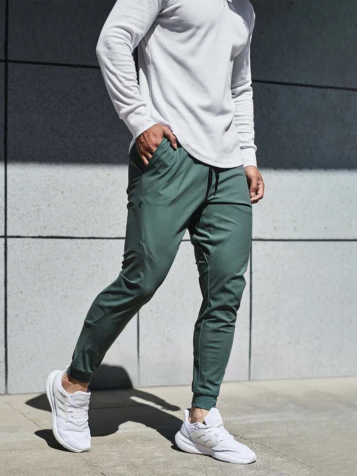 Close-up of men's performance jogger fabric, highlighting comfort, stretch & quality.