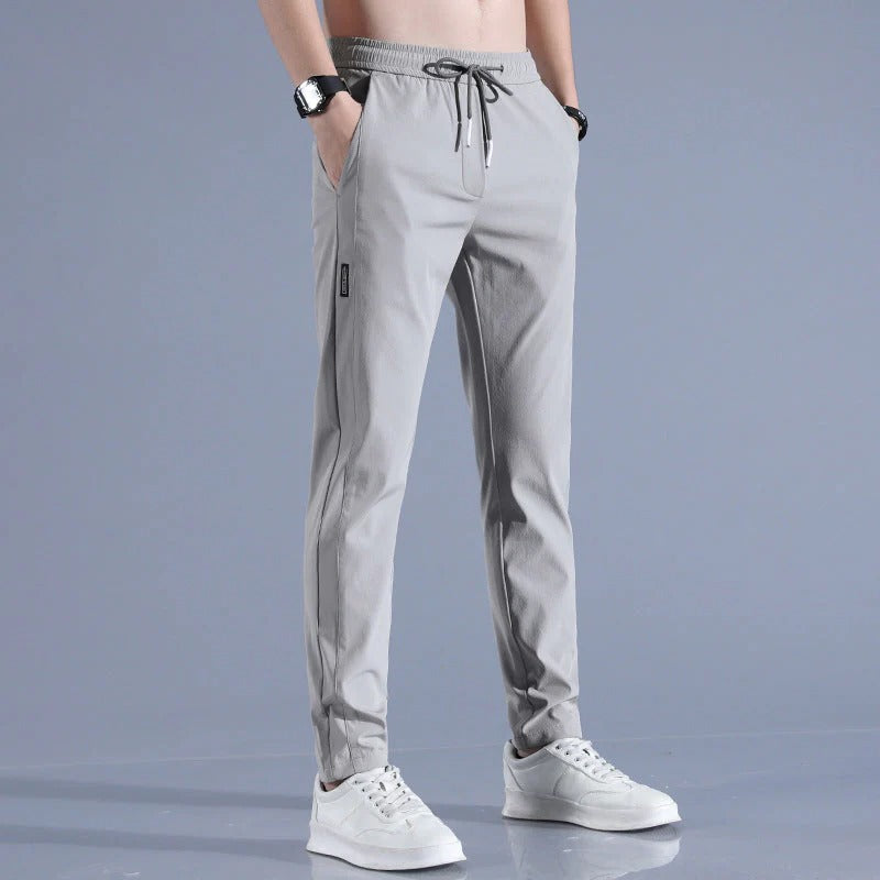 Men's performance long golf pants in a sleek grey, designed for comfort and style on the course.