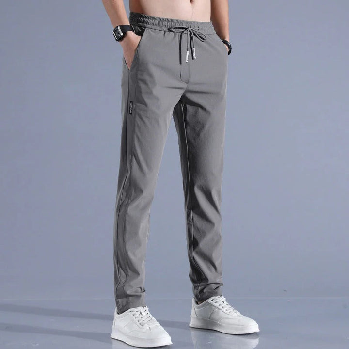 Front view of durable men's long golf pants with practical pockets, ideal for performance and everyday style.