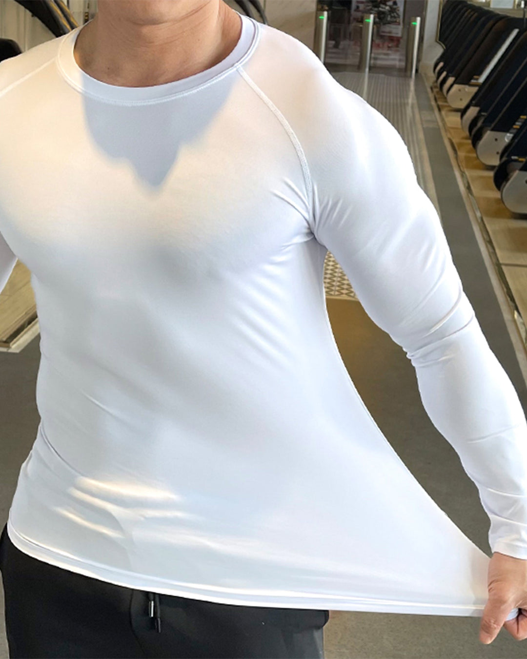 Contemporary Men's Long Sleeve Top, shoulder cut detail, perfect for active training.