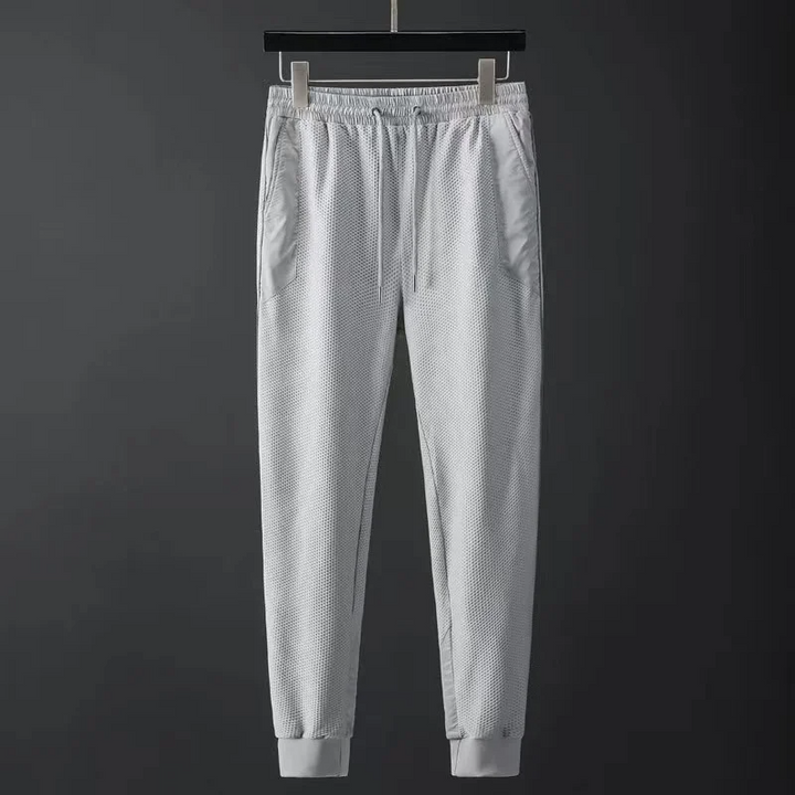 Modern men's urban fashion techwear tracksuit, an athletic set for casual and active wear.