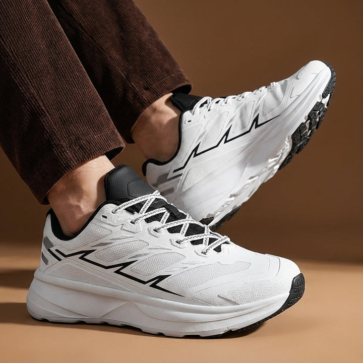 Close-up of the durable grip sole on men's performance trail shoes, built for stability.