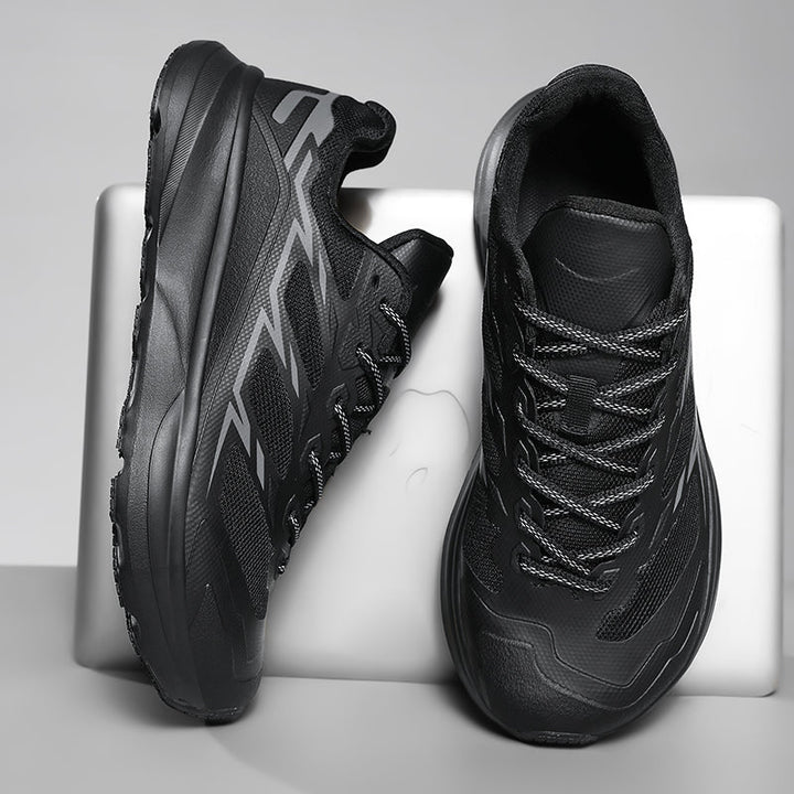 Detail of the breathable mesh upper on men's performance trail sneakers, ensuring cool comfort.