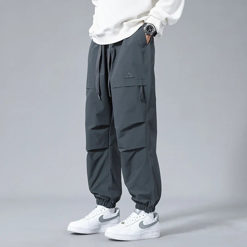 Men's performance utility joggers in a comfortable tapered fit, perfect for activewear & casual style.