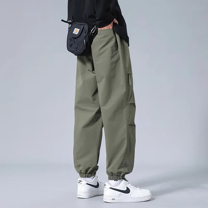 Green men's utility joggers offering ultimate comfort and a modern tapered fit, suitable for any casual activity.
