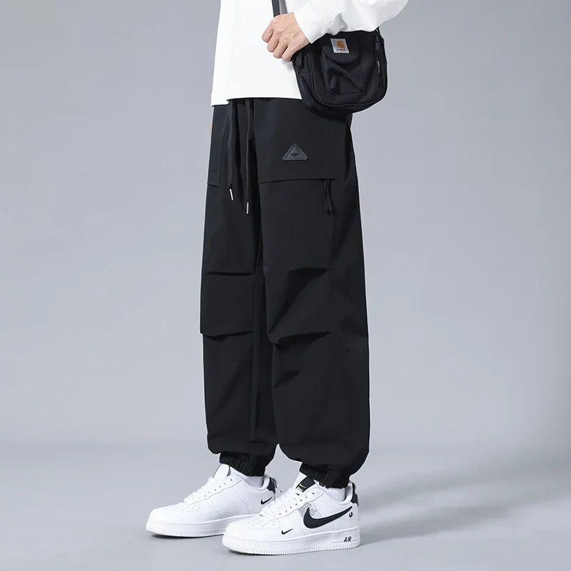Comfortable men's joggers with a drawstring waist and secure zippered utility pockets, great for active lifestyles.