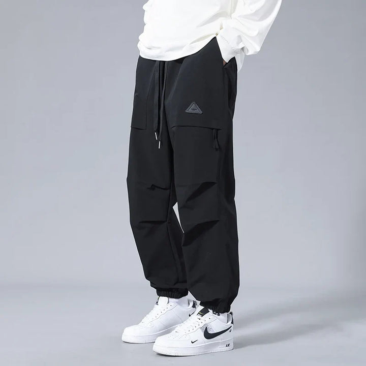 Stylish men's performance joggers, tapered fit, available in multiple colors, perfect blend of comfort & utility.