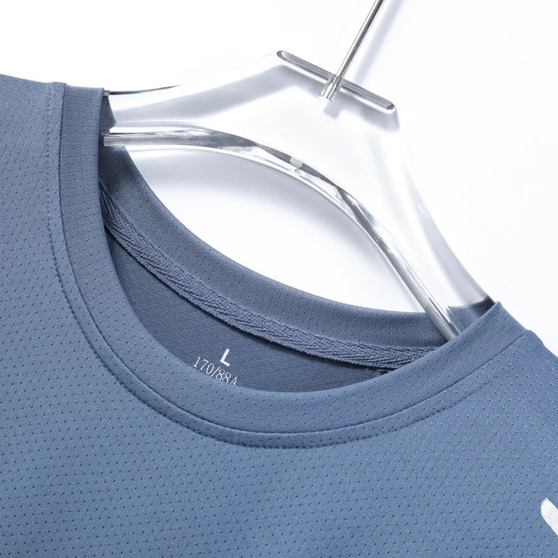Close-up of lightweight moisture-wicking fabric on a men's dry-fit performance Velocity Tech Tee.