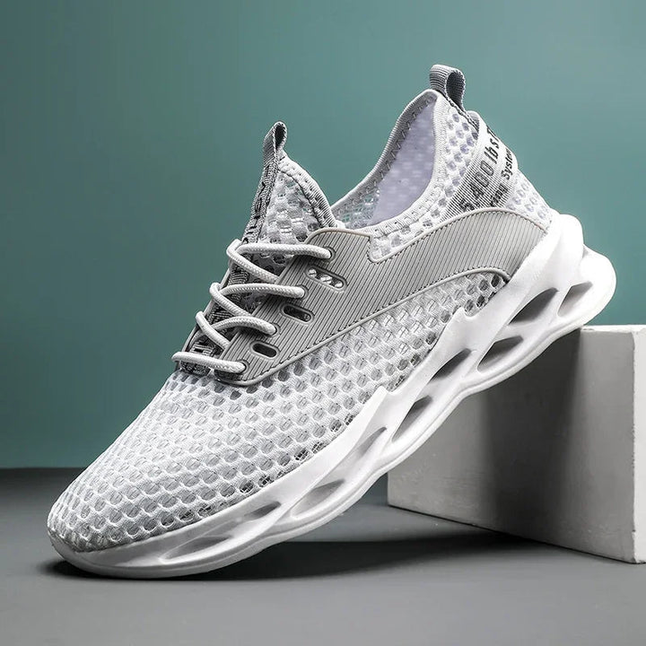 Top view of breathable men's camo mesh trainers, ideal athletic footwear for runners & sports.