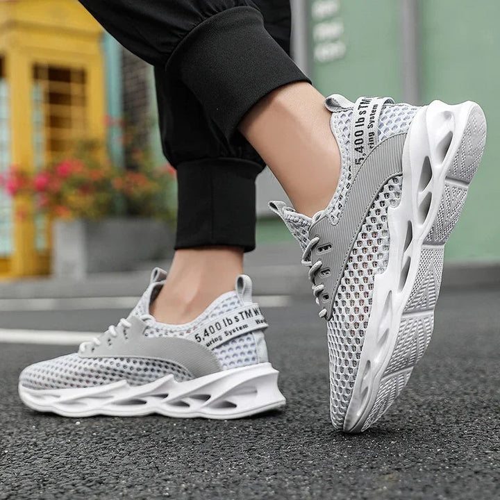 Close-up of Phantom Camo mesh on men's running sneakers, highlighting breathable & lightweight material.