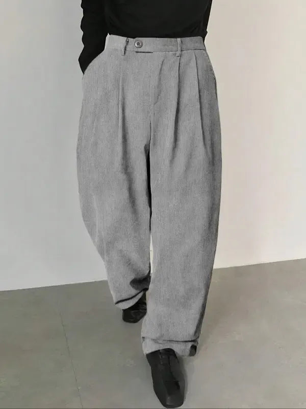 Sophisticated men's tailored wide-leg trousers with pleats. Perfect dress pants for formal office or smart casual looks.