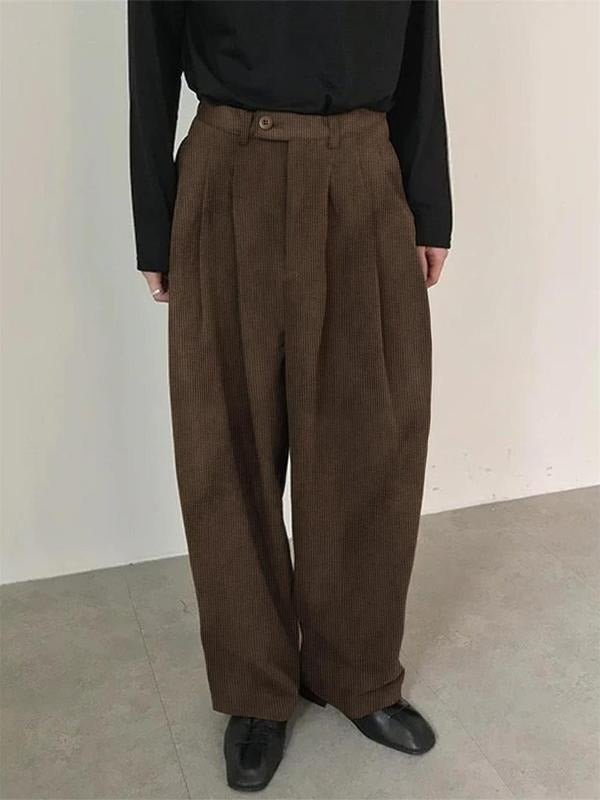 Comfortable men's wool blend pleated tailored dress trousers. Wide leg design offers a modern, sophisticated formal look.