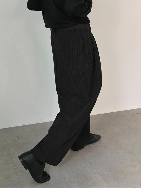 Men's formal pleated trousers. Tailored wide-leg design in a sophisticated wool blend, perfect for office and dress wear.