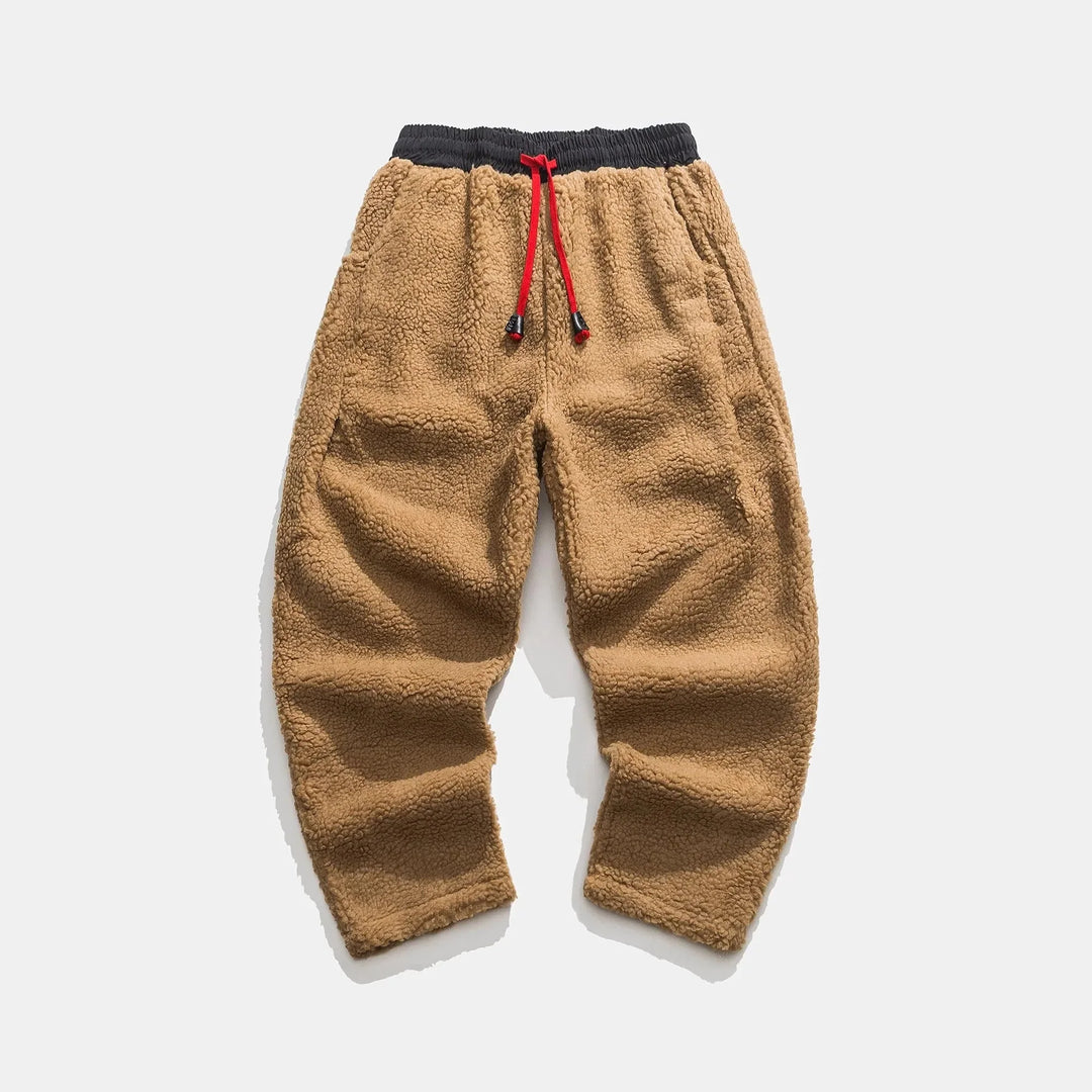 Close-up of soft plush fabric on men's comfort joggers, perfect for loungewear & casual style.