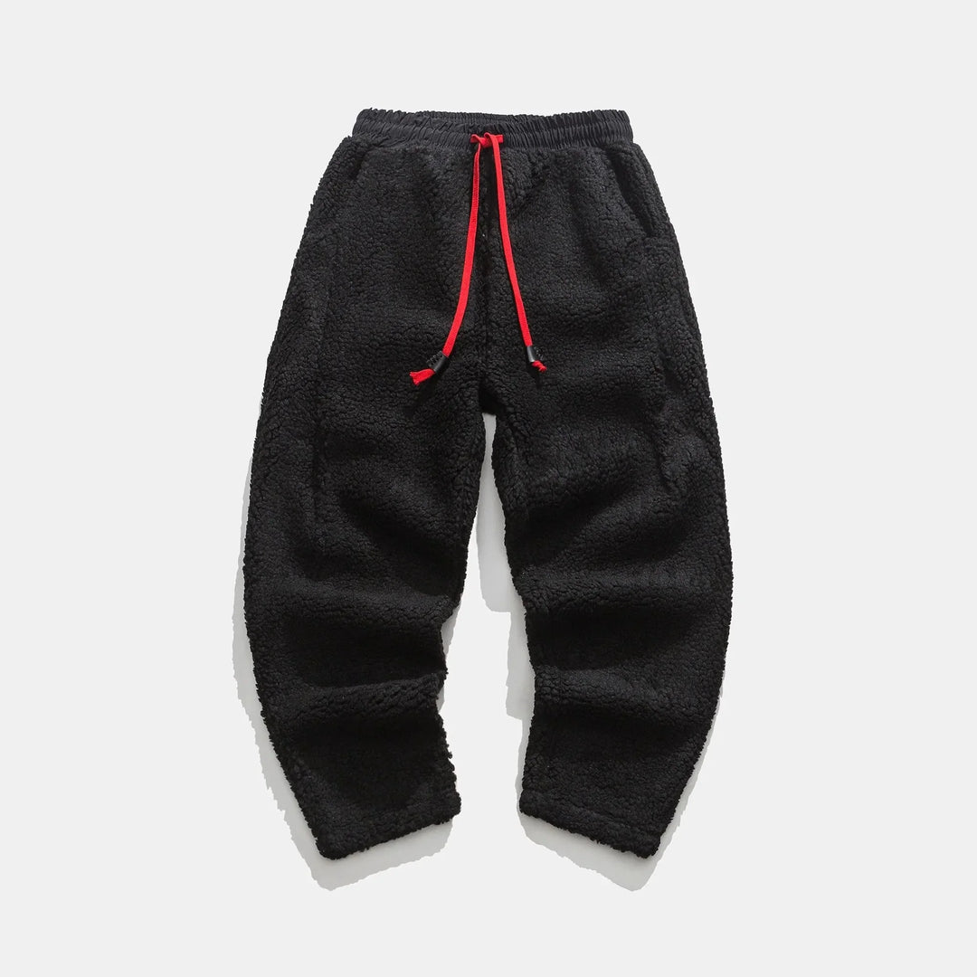 Comfortable men's plush sweatpants for lounging. Drawstring waist & relaxed fit for ultimate comfort.