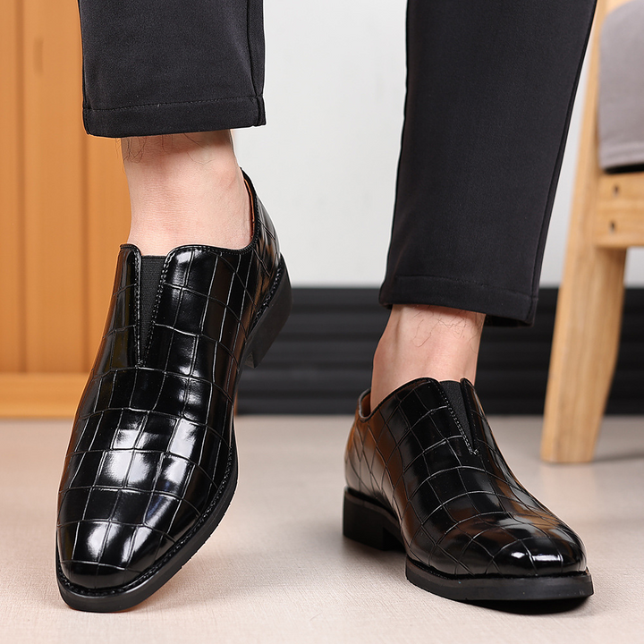 Detail of the polished toe on men's elegant formal dress shoes for business meetings & events.
