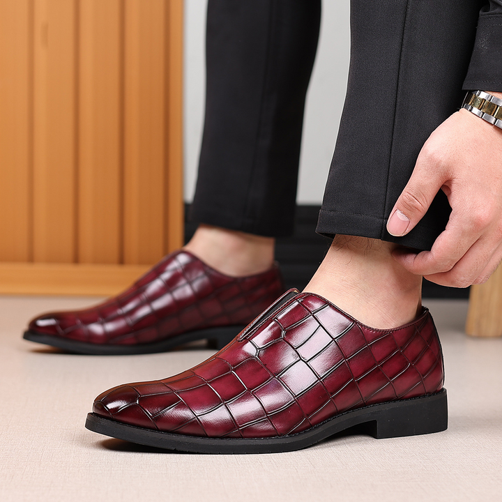 Full view of men's polished black dress shoes, ideal for professional office wear and formal events.