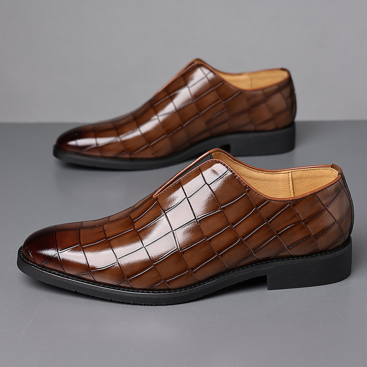 Highly polished men's dress shoes, providing an elegant touch to business attire and event fashion.