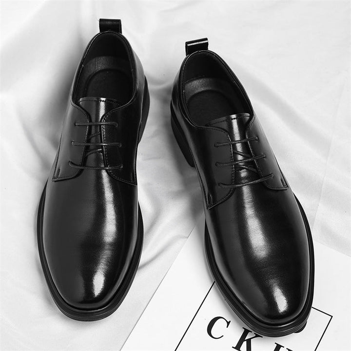 Classic black polished men's dress shoes, essential comfortable footwear for business & formal occasions.