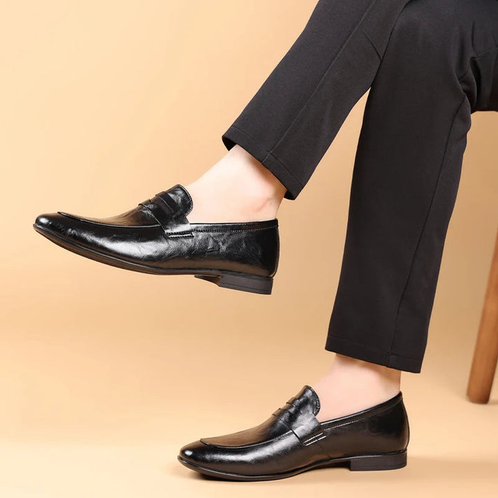 Versatile men's brown polished leather slip-on loafers for both formal & business casual.