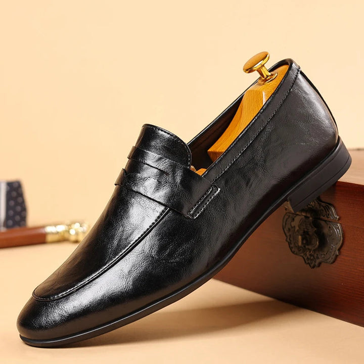 High-quality men's black slip-on dress loafers, durable polished leather for a sleek look.