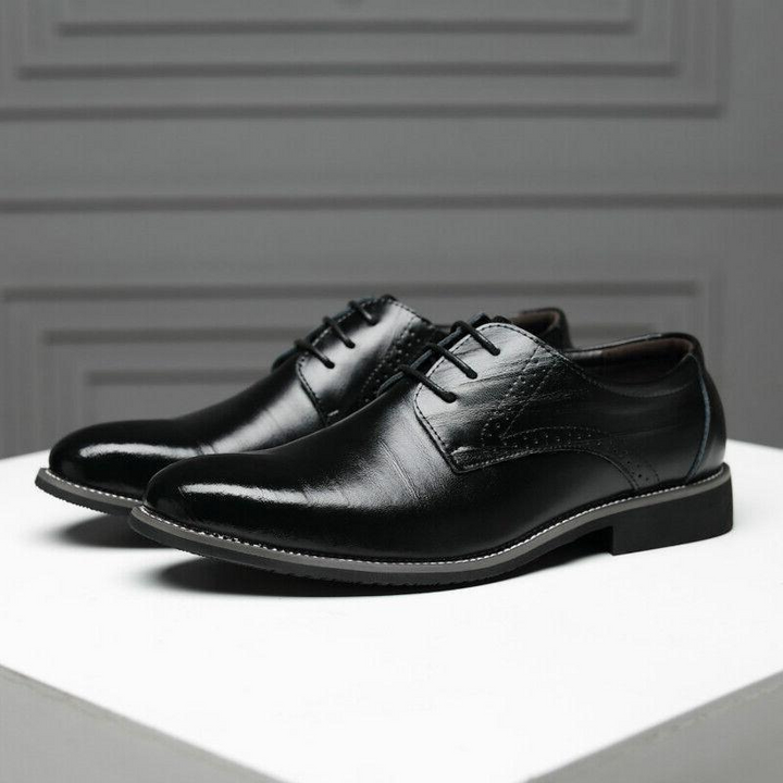 Genuine leather men's oxford shoes, highly polished, offering classic style for business & formal wear.